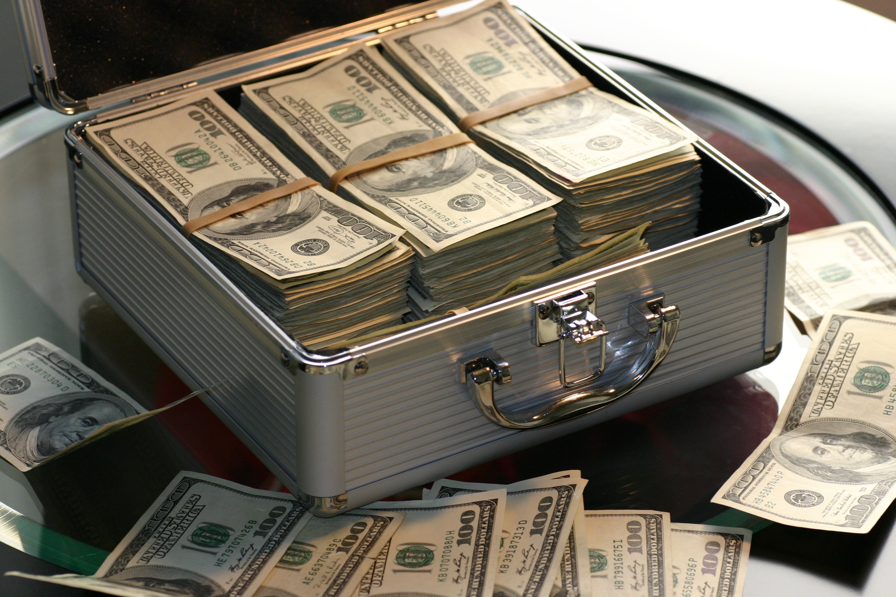 Hard Cash on a Briefcase - Photo by Pixabay: https://www.pexels.com/photo/hard-cash-on-a-briefcase-259027/